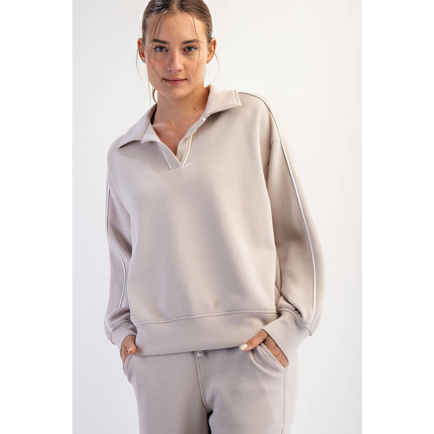 Soft, scuba material long sleeve sweatshirt with white double piping seams down both sides, a perfect style for casual athleisure type dressing 