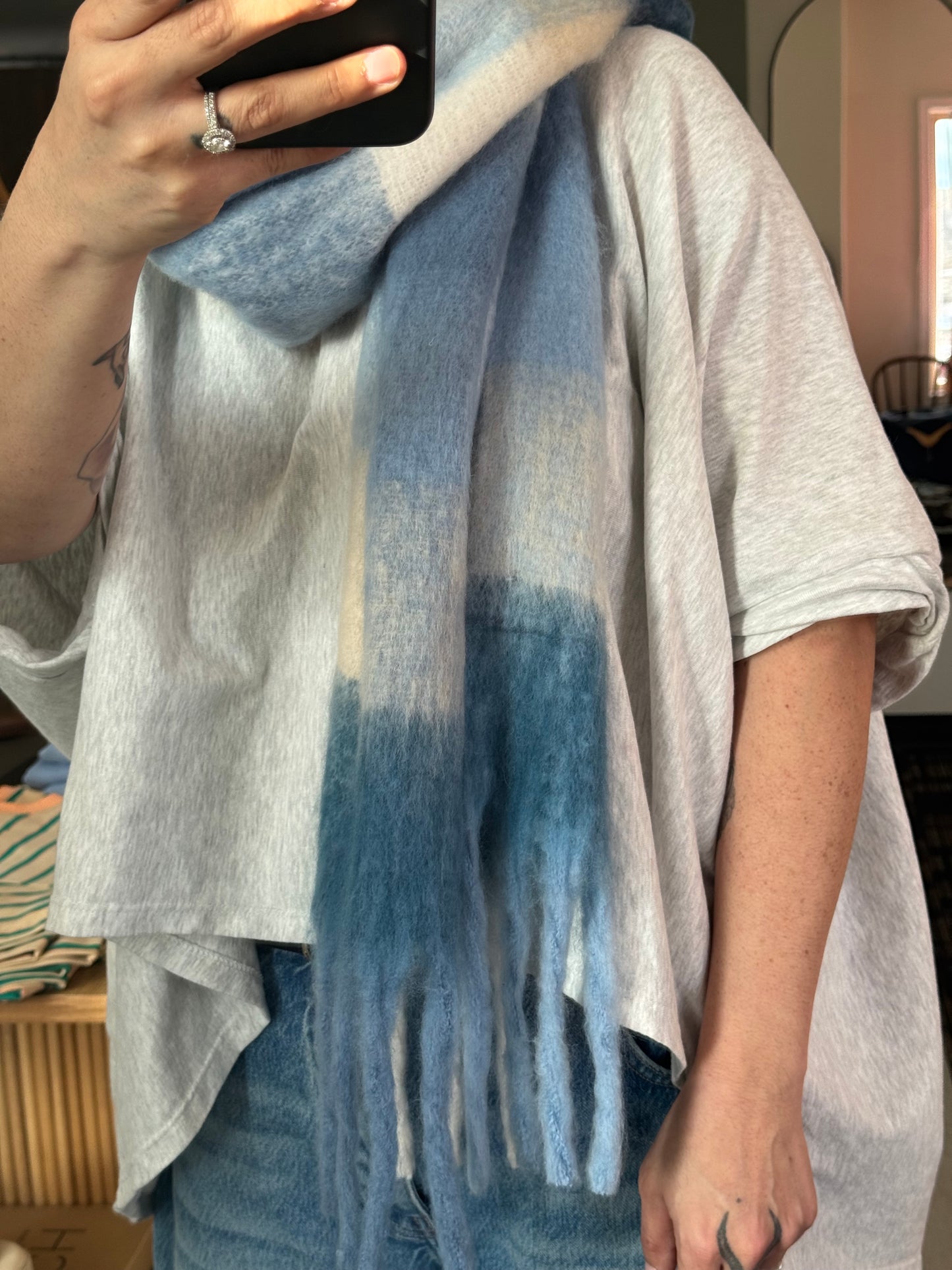 This wide fringe edge scarf is the perfect winter blues. This color is multi blue featuring a range of 4 blues and a cream that ties it all together. The blue checker like pattern makes this such a soft blue style sure to match with many styles for winter and spring style inspo 